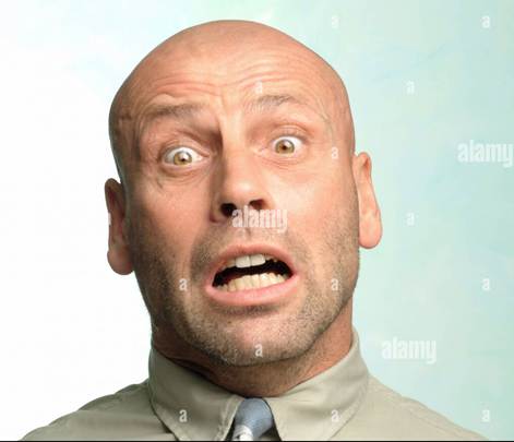 Man with a surprised and scared look on his face Stock Photo - Alamy